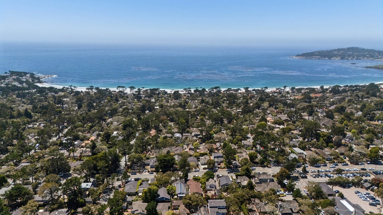 Aerial view of Carmel Beach and the Southwest Carmel Golden Rectangle homes behind it, Carmel-by-the-Sea