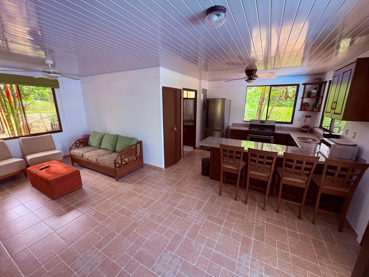 Move in ready 2 bedroom / 2 bathroom home with window ocean view and pool in Ojochal.