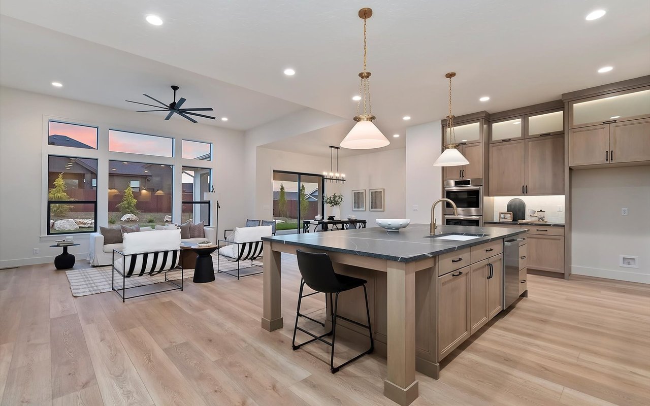 Kitchen and open living room in new modern prairie home in Star, Idaho.