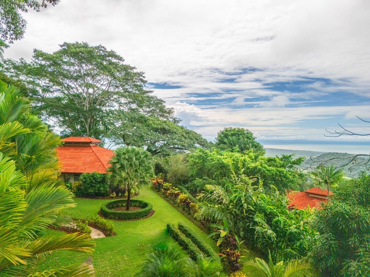 Ocean, jungle & mountain views on a meticulously landscaped 3-home family compound