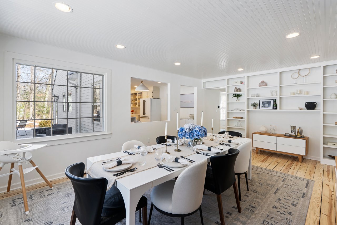 Dining room at 7 Shaw Drive Simsbury CT with built-in shelving and refinished hardwood floors