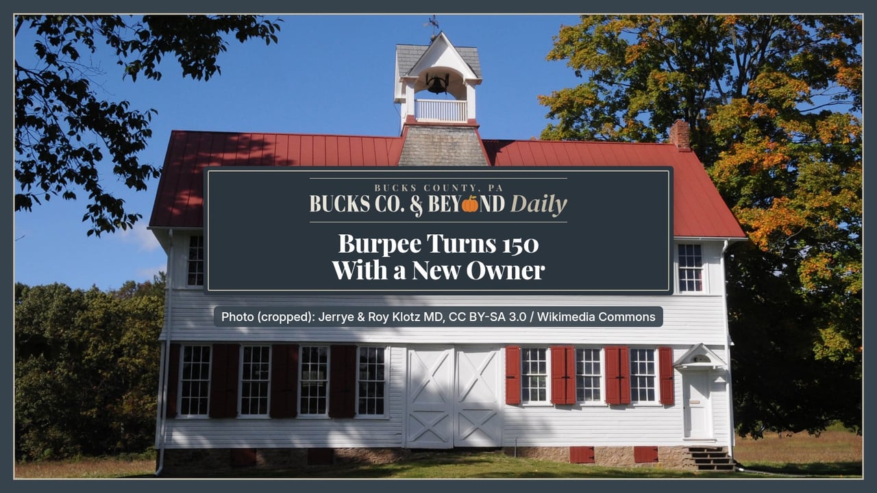 Bucks Co. & Beyond Daily: Burpee Turns 150 With a New Owner. A white clapboard building with a red metal roof, red shutters and a bell cupola at Burpee's Fordhook Farm in Doylestown Township, under a blue sky with early fall leaves.