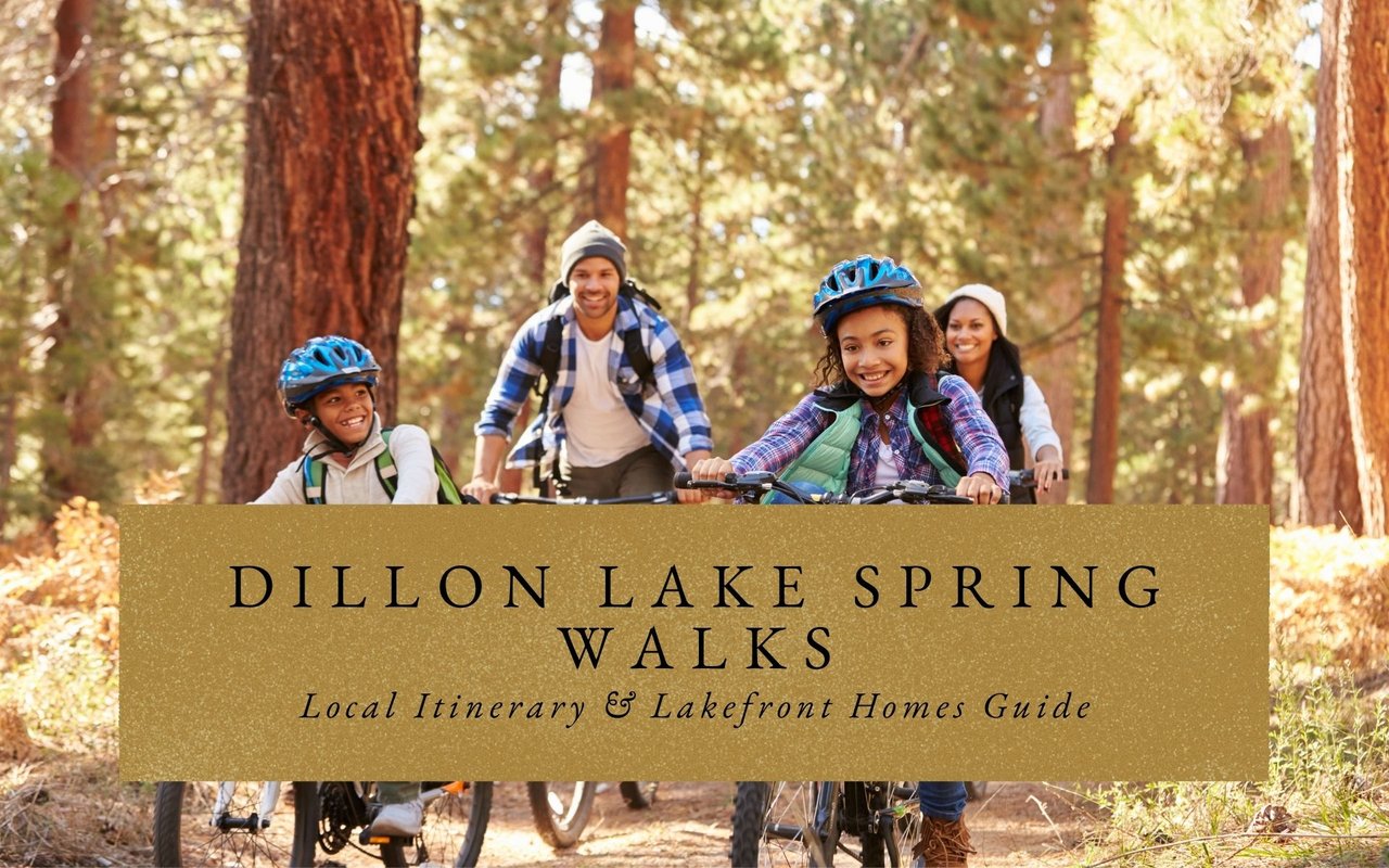 Family biking the Dillon Reservoir Recpath with Tenmile Range mountains across the lake on sunny spring day