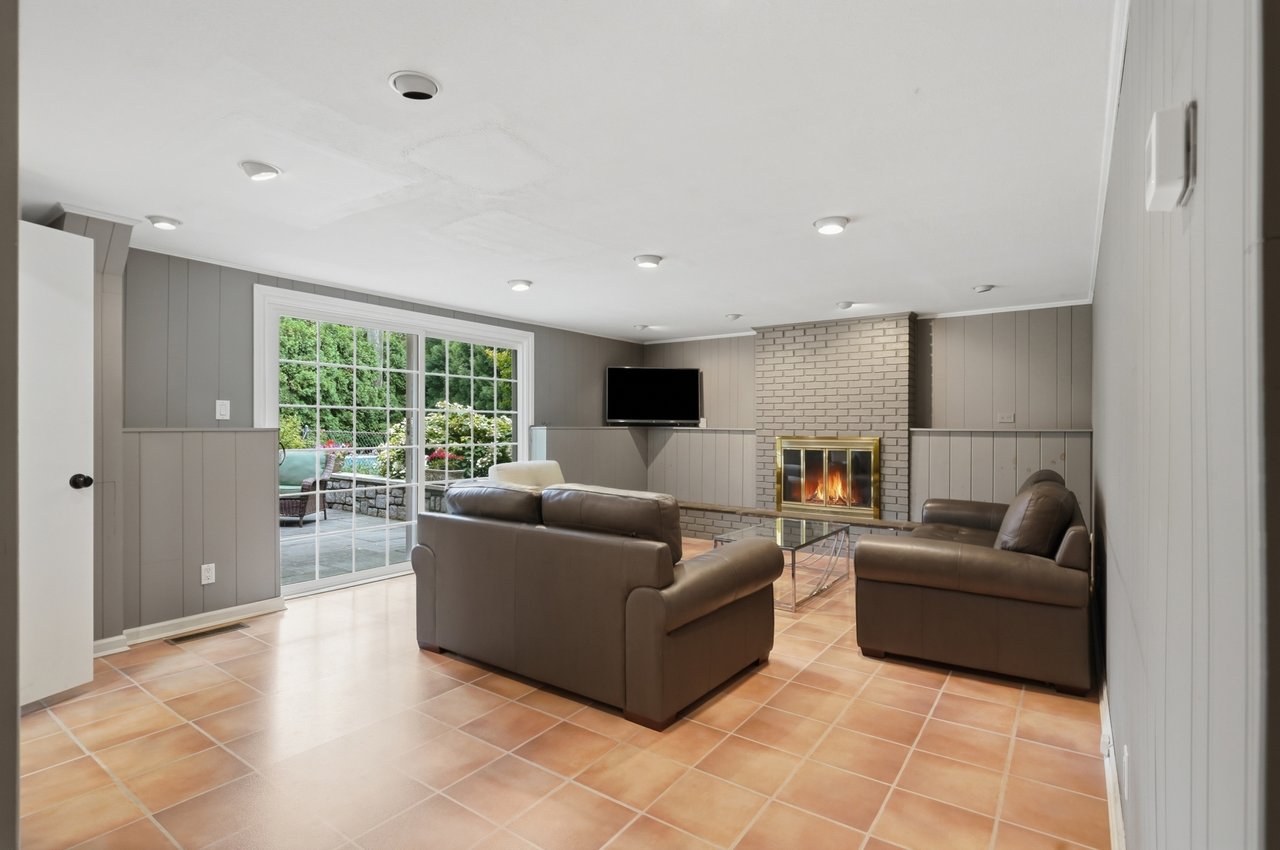 Den with sliding doors to outside patio