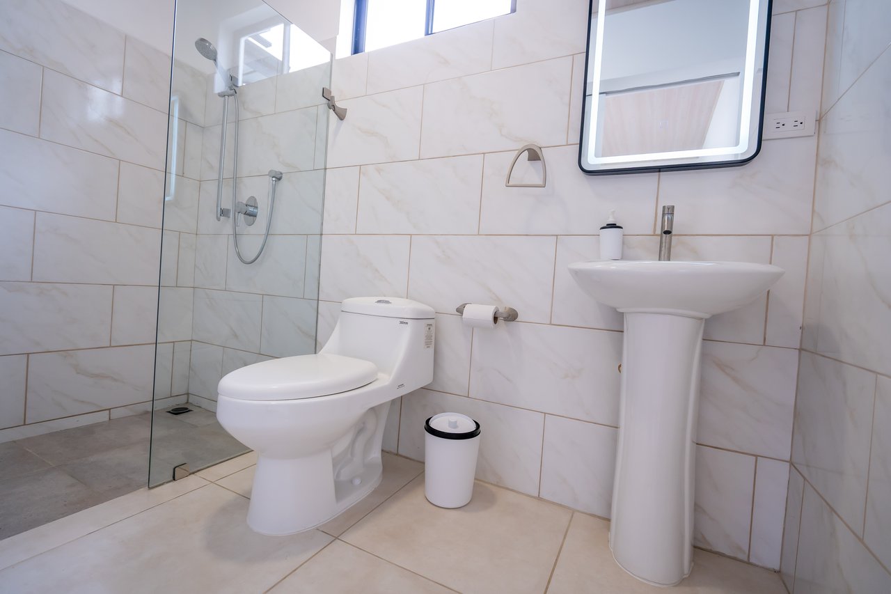 A House With An Upper Live-In Suite & Two Fully Serviced Downstairs Rental Apartments Less Than 1 km From The Entrance to Marino Ballena National Park