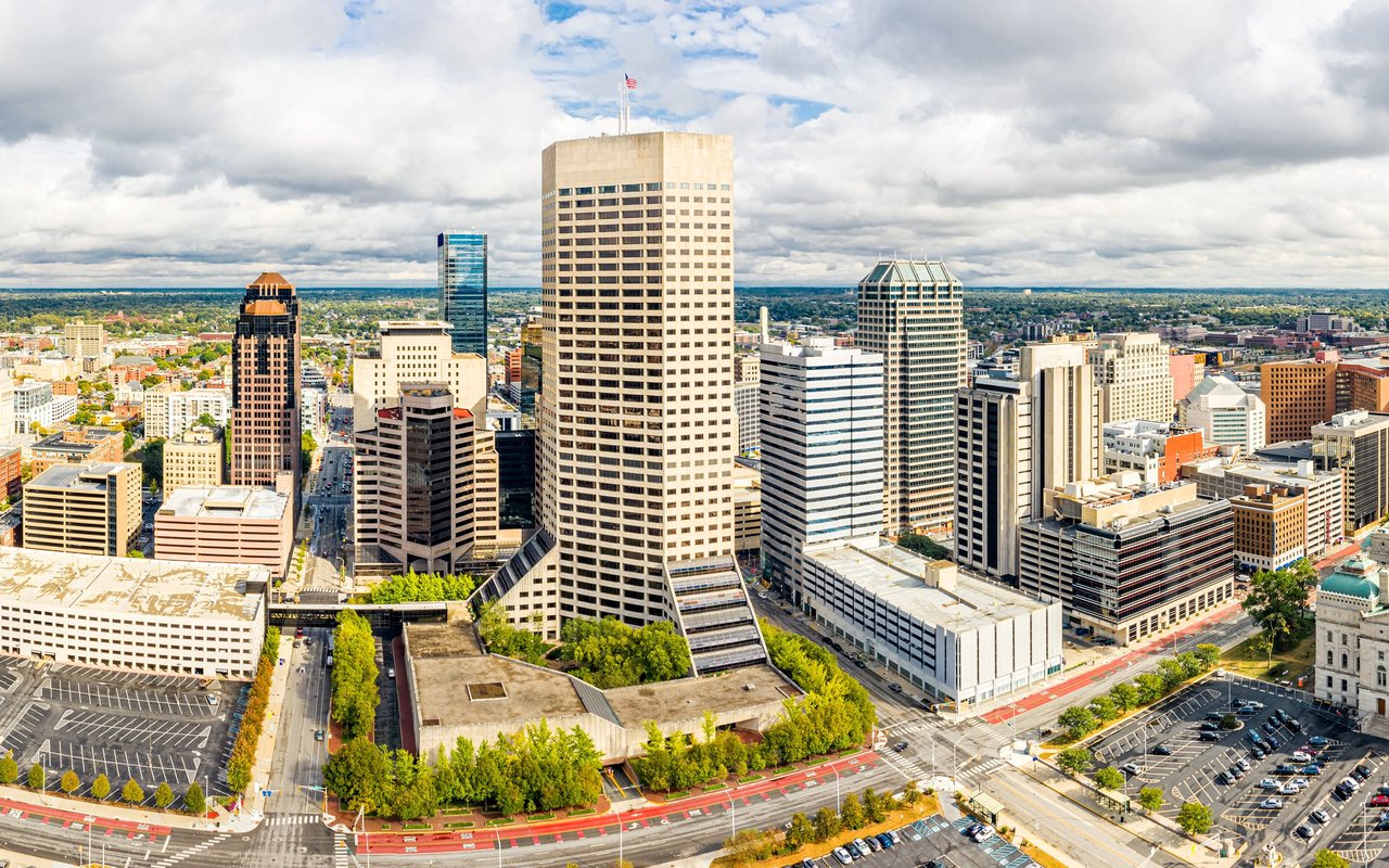 Aerial view of downtown Marion County, with office towers and tree-lined streets.