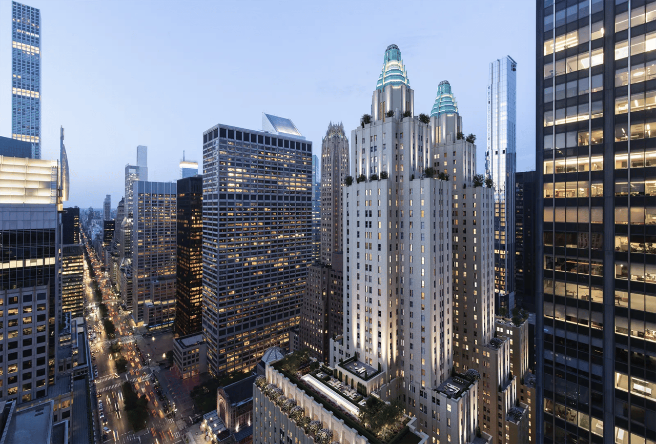 Waldorf Astoria Residences with twin turquoise-lit crowns among Midtown Manhattan high-rises at dusk.