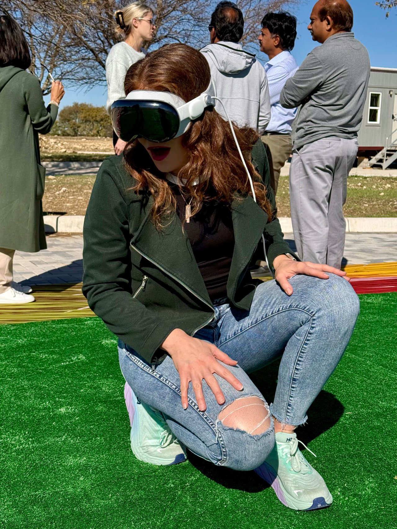 Paige Miranda demonstrates Treeline by Hillwood augmented reality AR technology preview future amenities Best Use Technology award