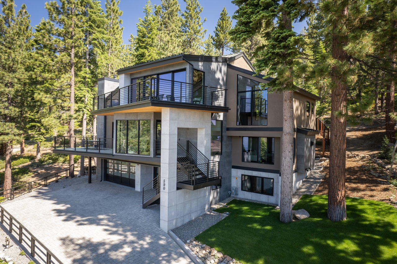 A luxury lakeside home in Incline Village with panoramic views of Lake Tahoe at sunset