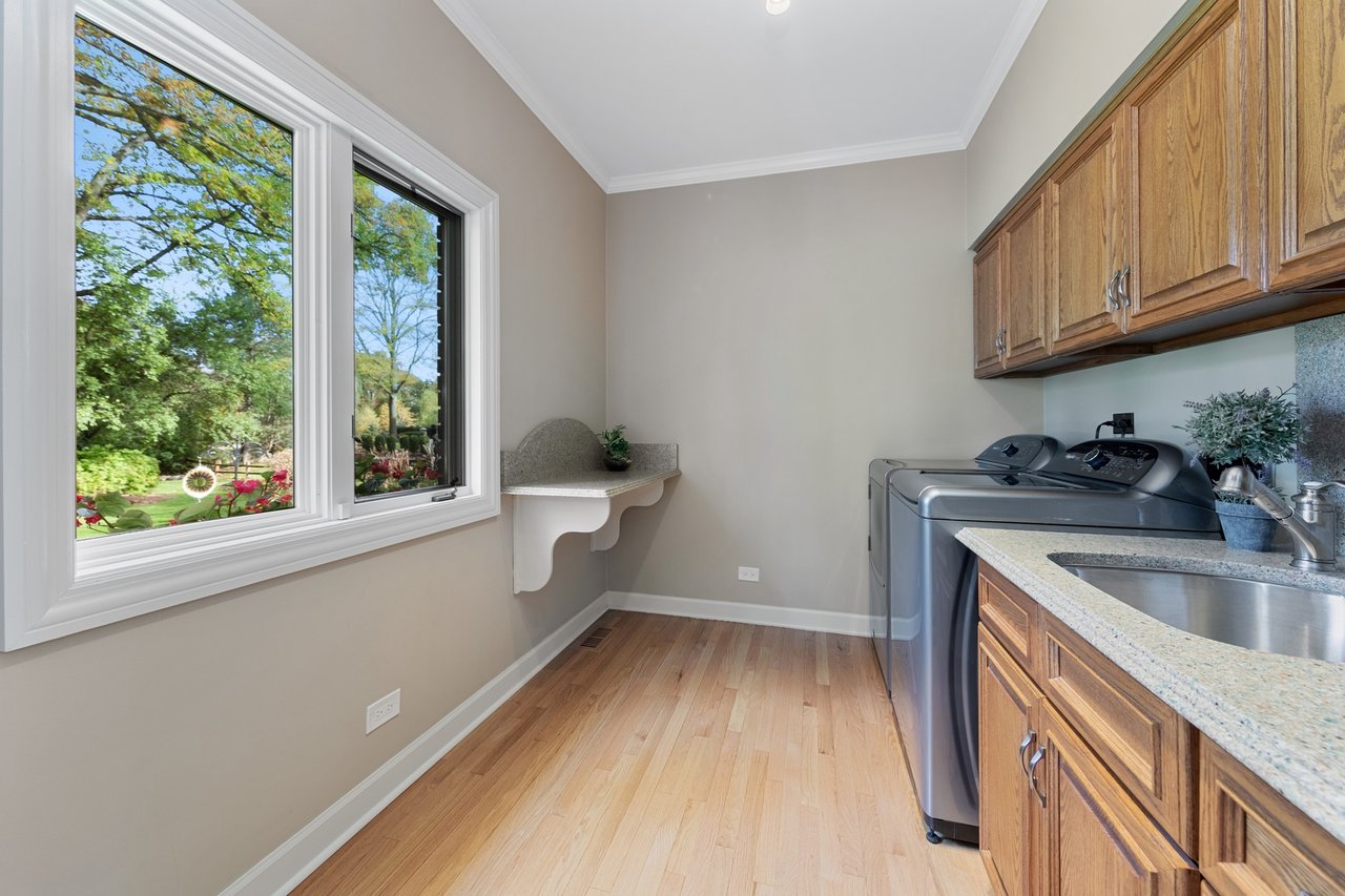 Beautifully Appointed Home in a Gated Community on Over an Acre of Professionally Landscaped Grounds with Pond Views