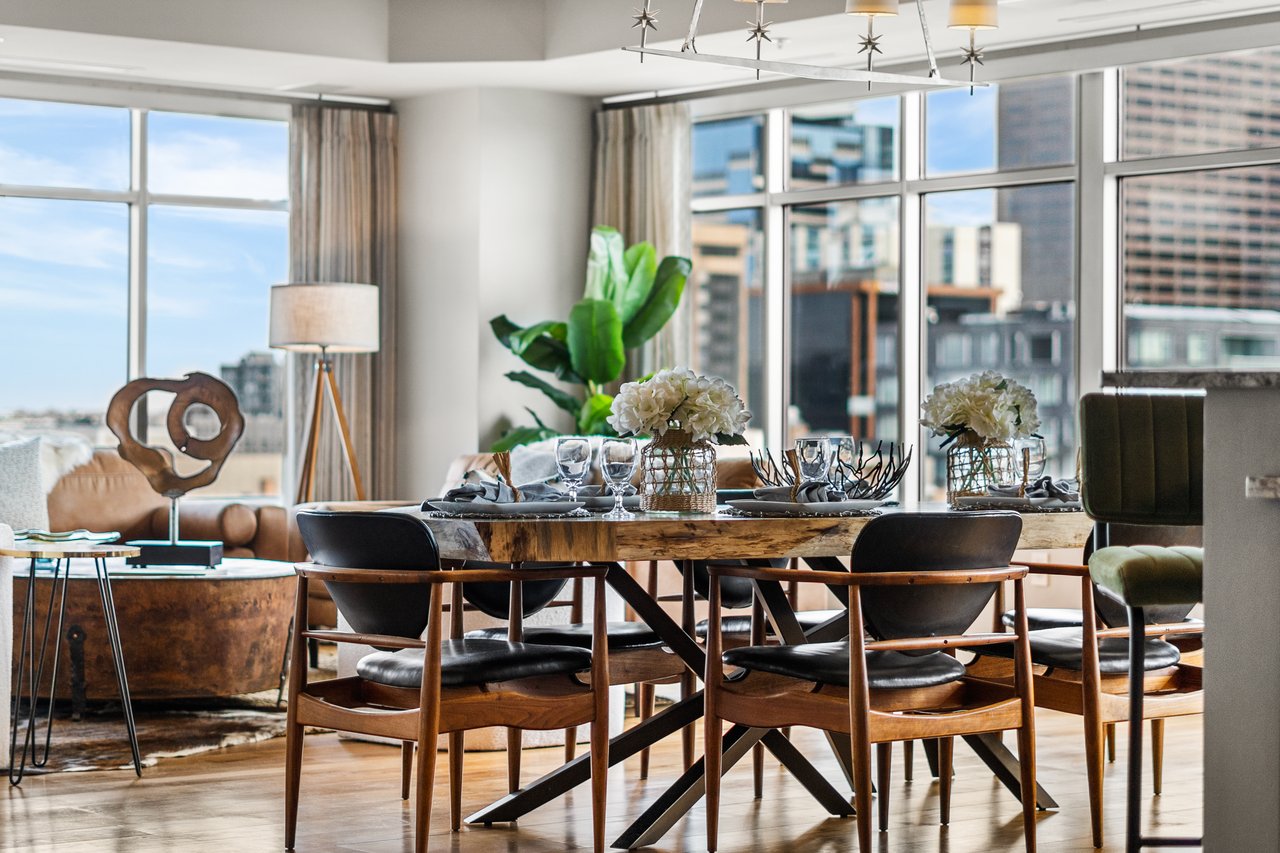 Modern dining area with city views in luxury LoDo Denver condo at 1411 Wynkoop Street