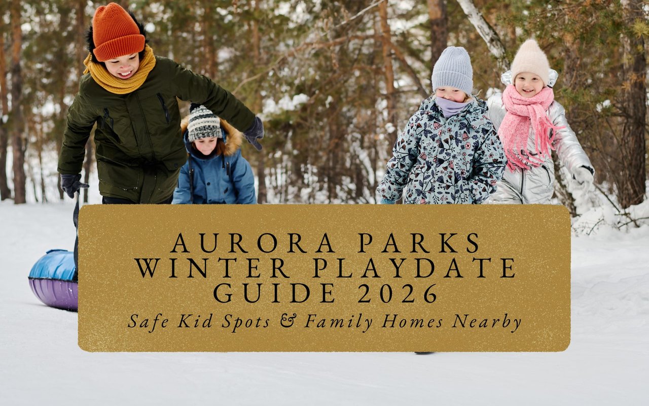 Group of bundled-up children laughing on snowy playground equipment at Aurora park, igloo structures nearby.