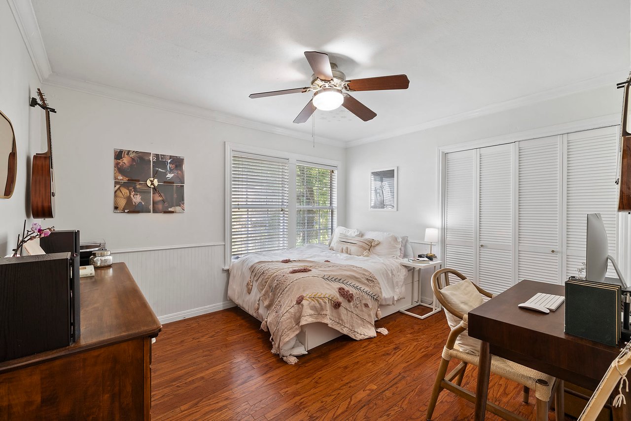 Bedroom with original wood floors, a desk, and ceiling fan, 2404 Westover Rd.