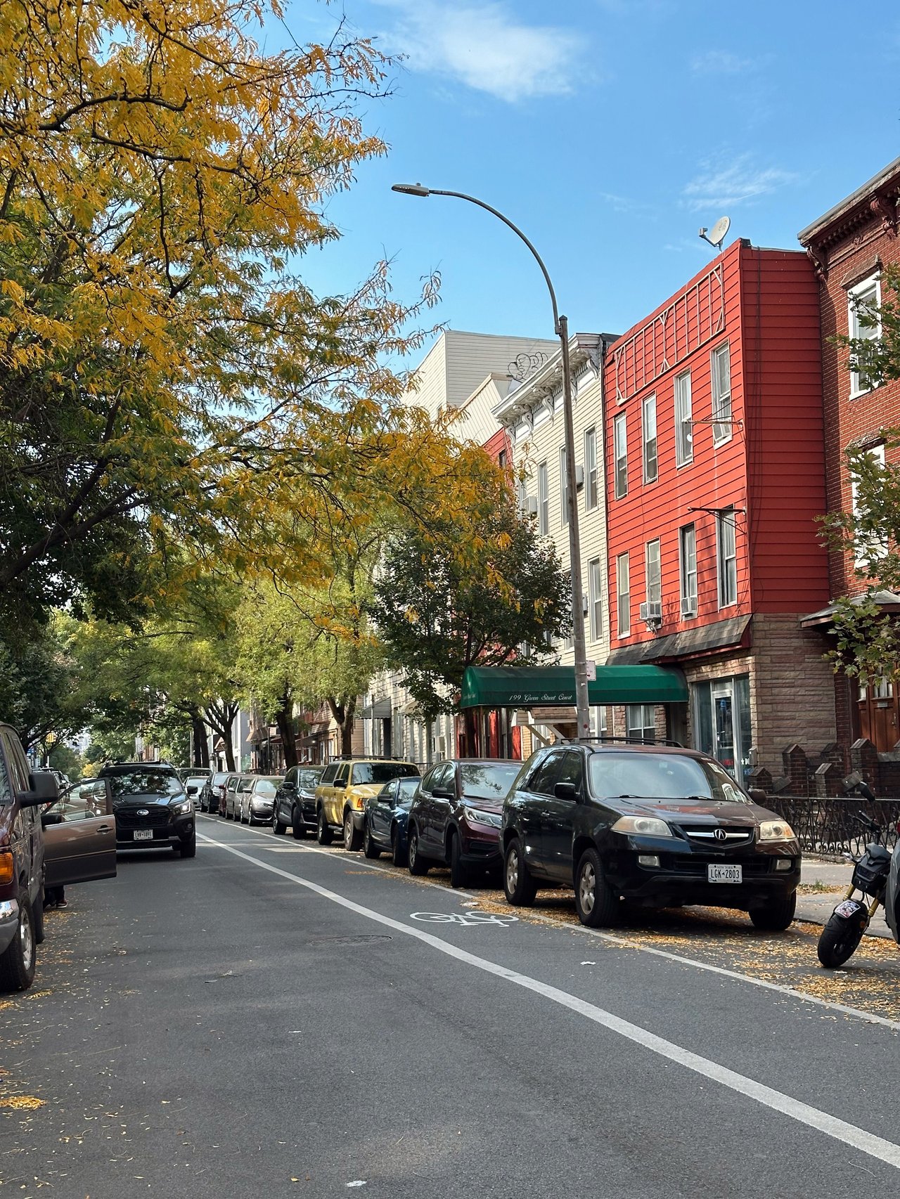 Historic townhouses, multifamily homes, loft buildings, and boutique condominiums along Linden Street in Bushwick, Brooklyn.