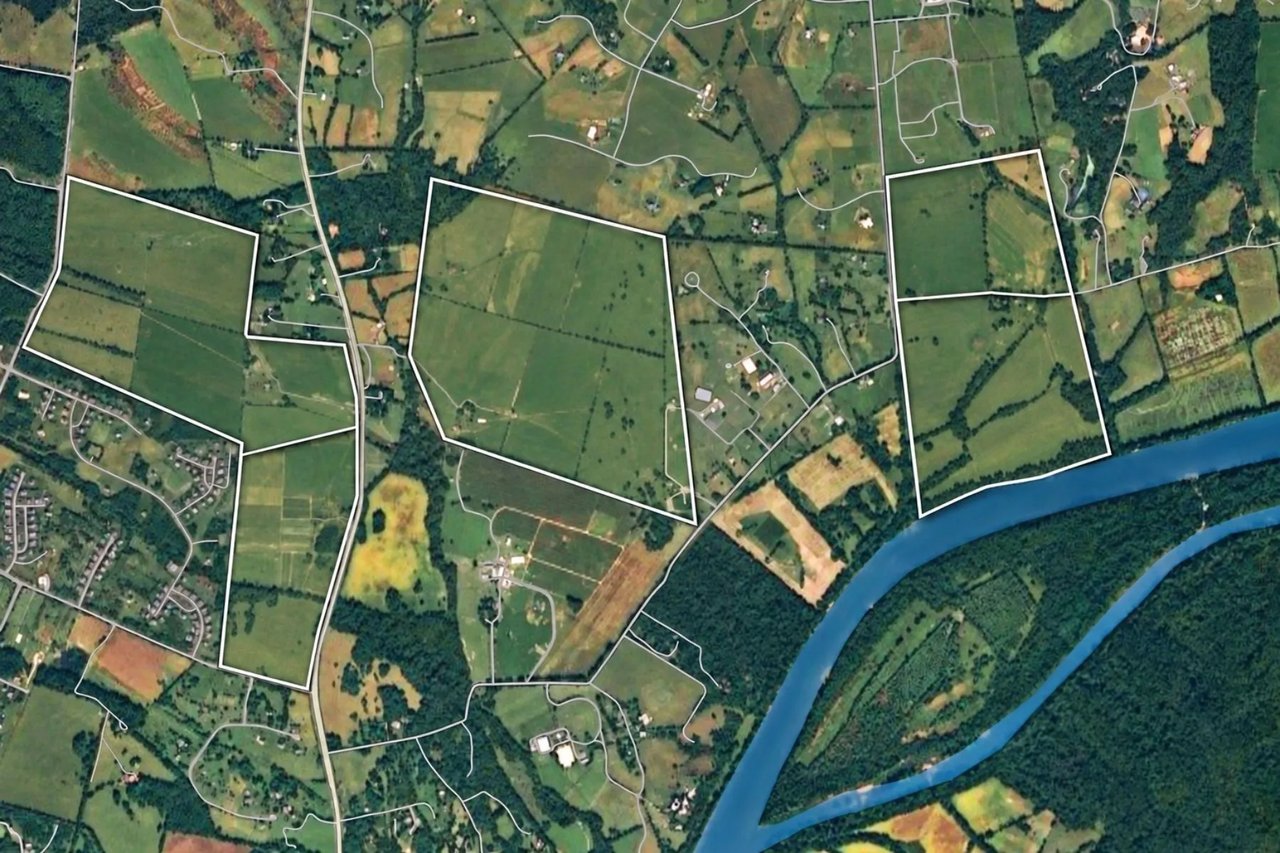 Aerial view of outlined rural parcels beside a curving river