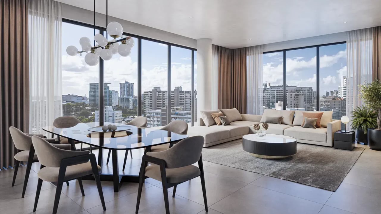 Modern apartment living and dining area with floor-to-ceiling windows overlooking the city.