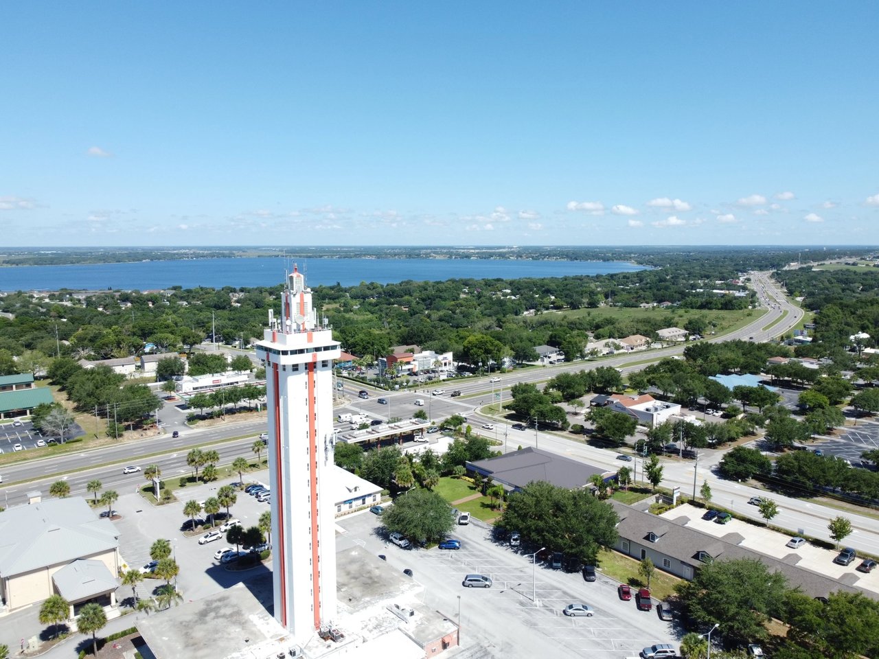 Aerial view of Clermont with the Citrus Tower, roads, and lake.