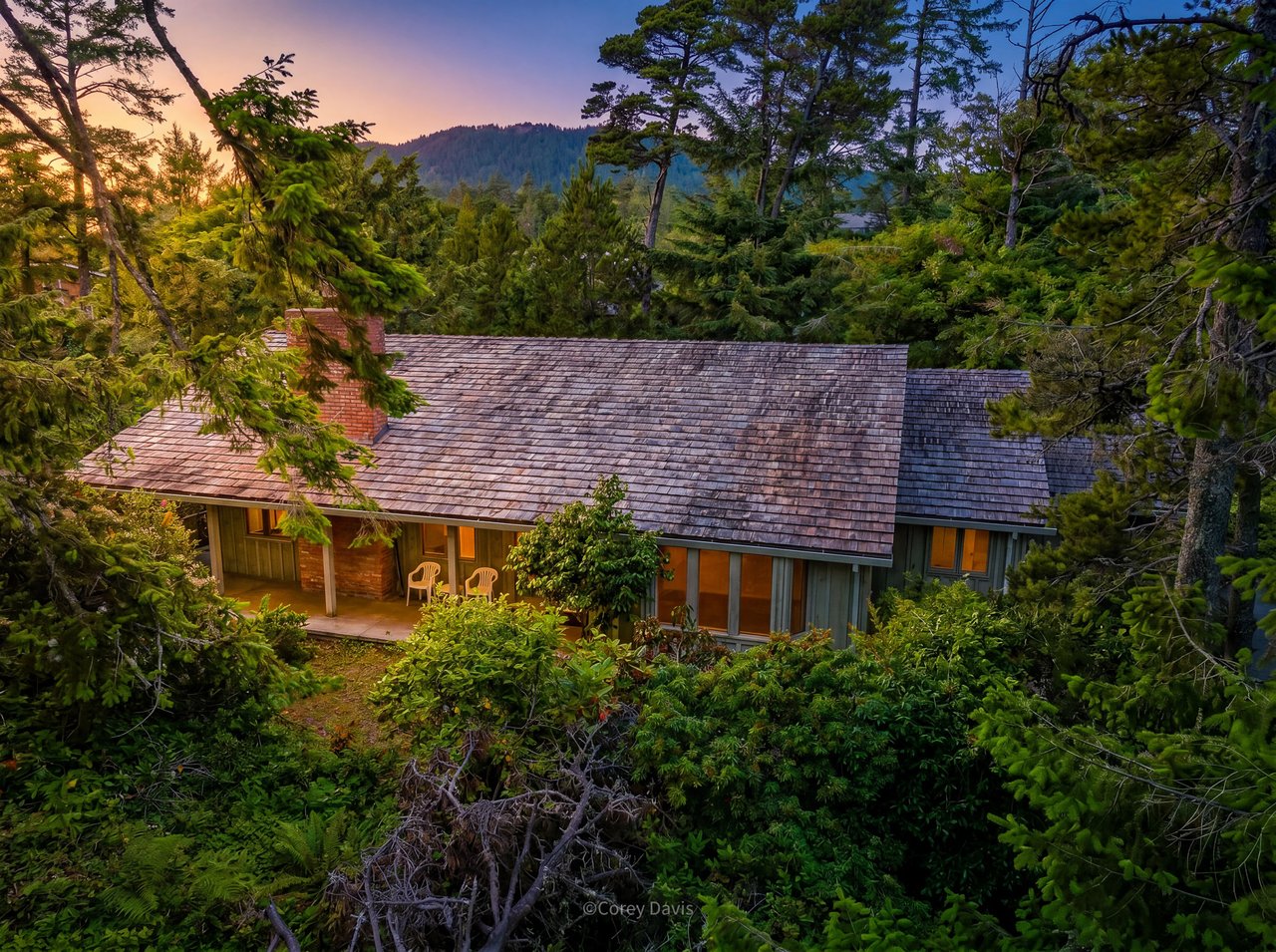 Sold private home at 141 Manzanita Ave in Manzanita, Oregon, listed by Meadow Davis and sold with buyer representation by Leisha Mizee-Riggert of Home + Sea Realty, with mature landscaping and beach access nearby.