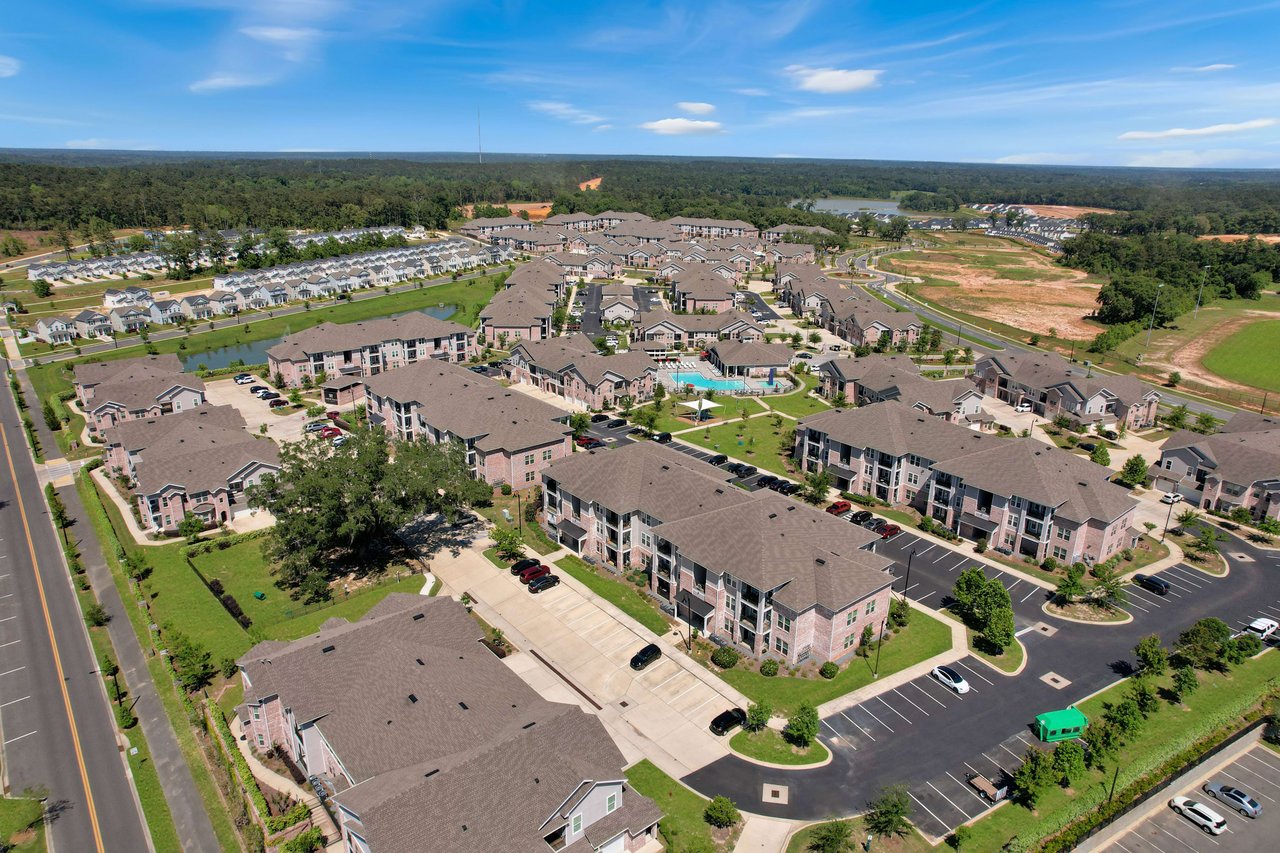 An aerial view of the Canopy neighborhood, highlighting the houses and surrounding green spaces.