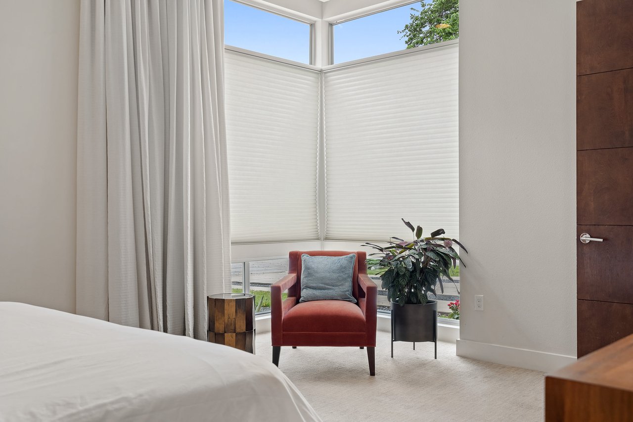 Bedroom sitting area with floor-to-ceiling windows at 34 Margranita Crescent, Tarrytown, Austin, TX