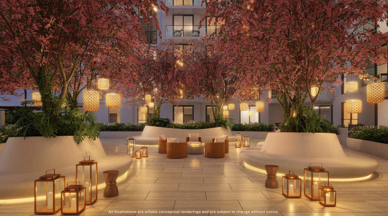 Cassia Residences courtyard with lounge seating, glowing lanterns, and flowering trees at dusk.