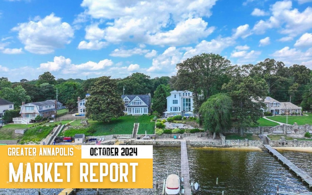 Greater Annapolis October 2024 market report over an aerial view of waterfront homes and docks.