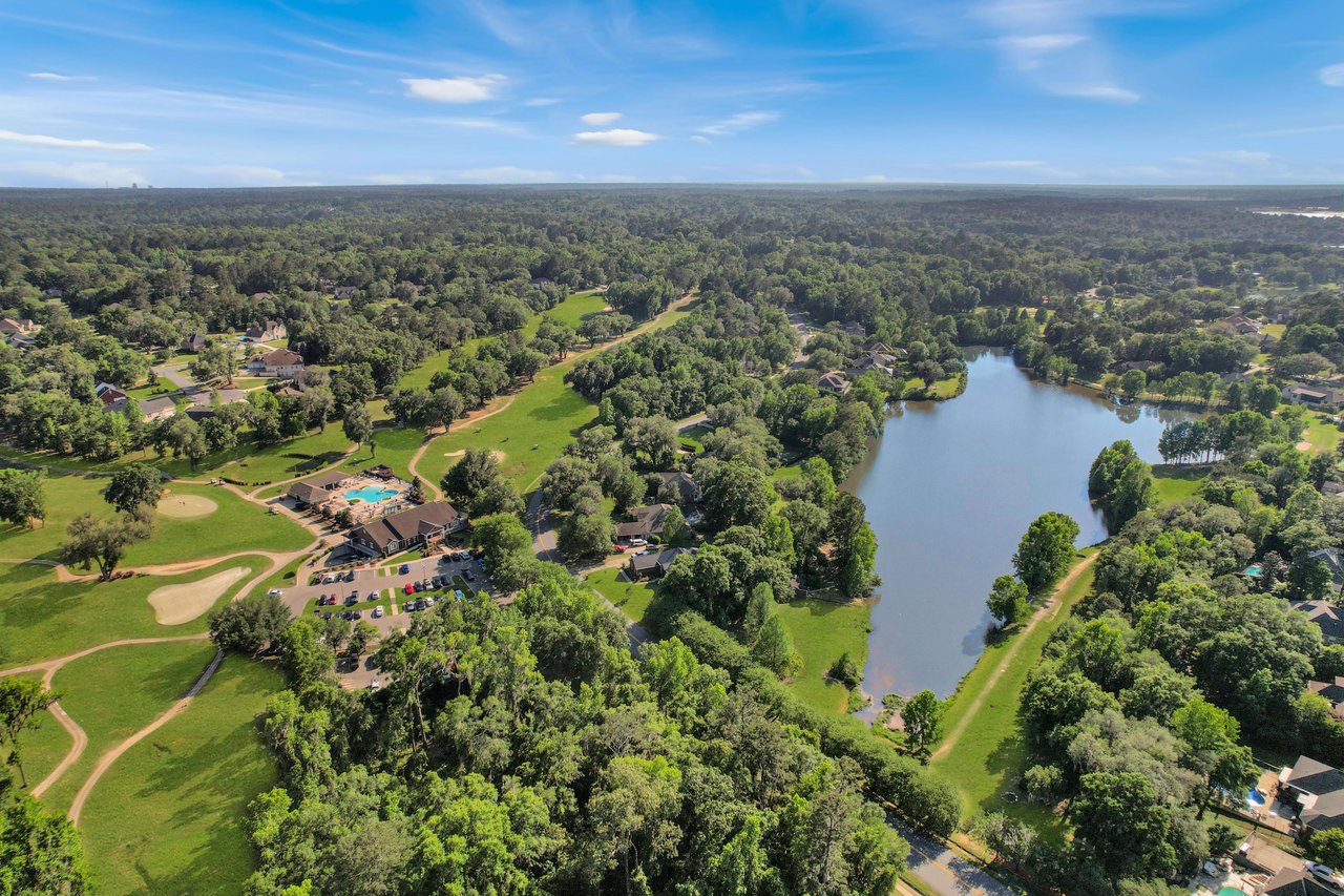 Another aerial view of the Summerbrooke community, highlighting the golf course and houses near the lake.