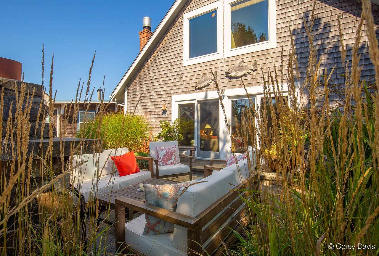 Sold Manzanita beach cottage at 273 Edmund Ln represented by Meadow Davis of Home + Sea Realty with hot tub, outdoor fireplace, and walkable location