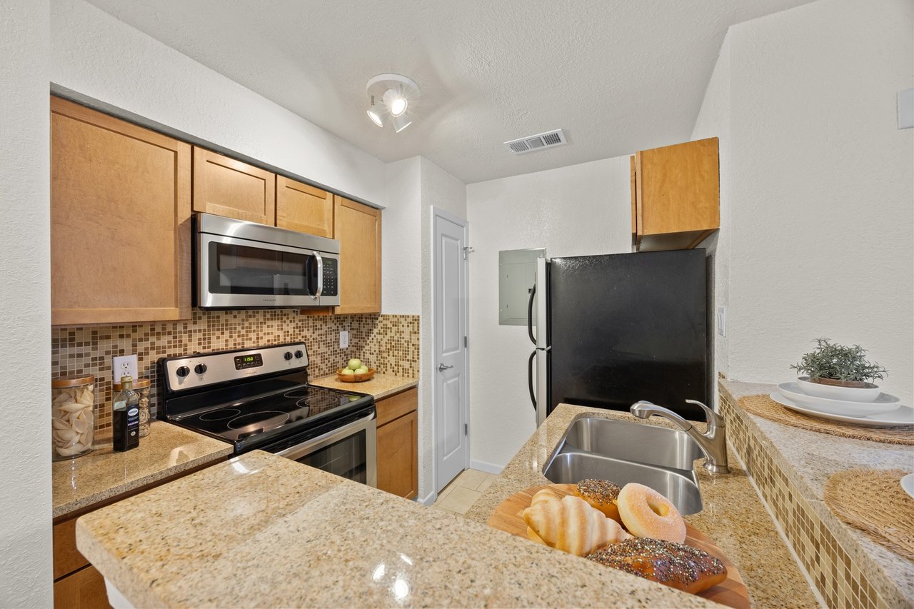 Top-Floor Condo Retreat in Gated Ivy Condos | Private Balcony + Tree-Filled Views