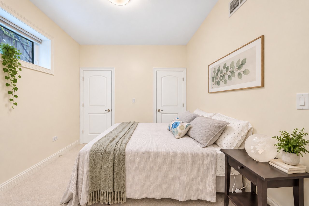 Bedroom with neutral walls and natural light