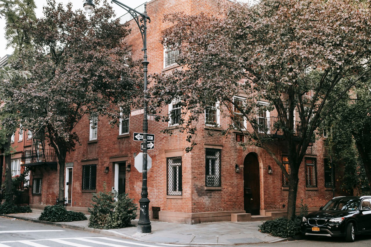 Explore Thompson Street's architectural history, including Federal and Greek Revival houses, Italianate and Neo-Grec facades, early twentieth-century apartment buildings, and the Sullivan-Thompson and South Village Historic Districts.