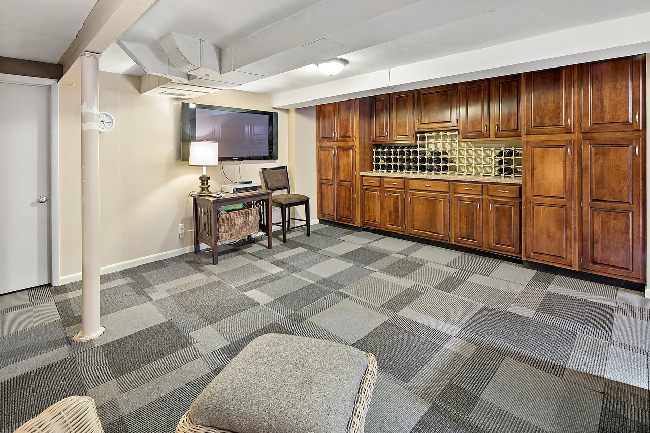 A Special Retreat on a Prized One Acre Lot With Pool and Tennis Court