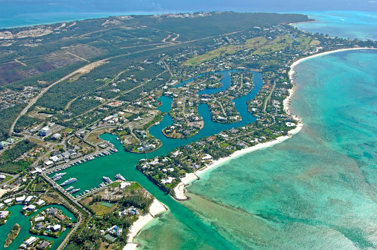 An aerial view of a small tropical island town.