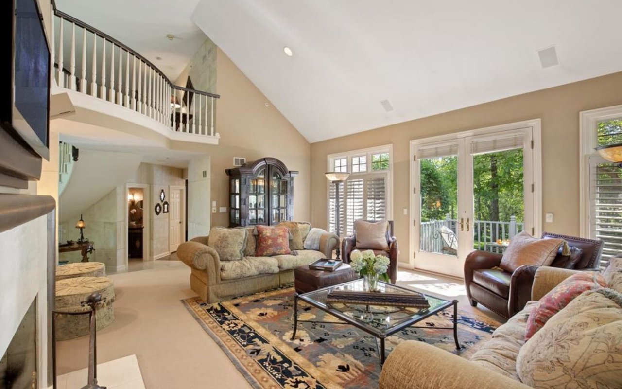 This Stately Brick Traditional Home Is Uniquely Positioned On One Of The Most Private Lots In Royal Melbourne