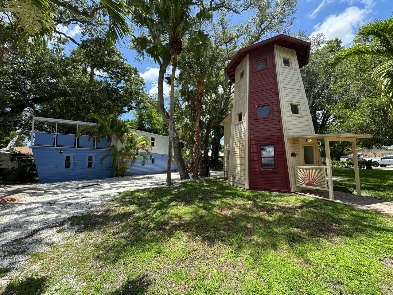 Sarasota's Nautical Charm: A Boat and Lighthouse