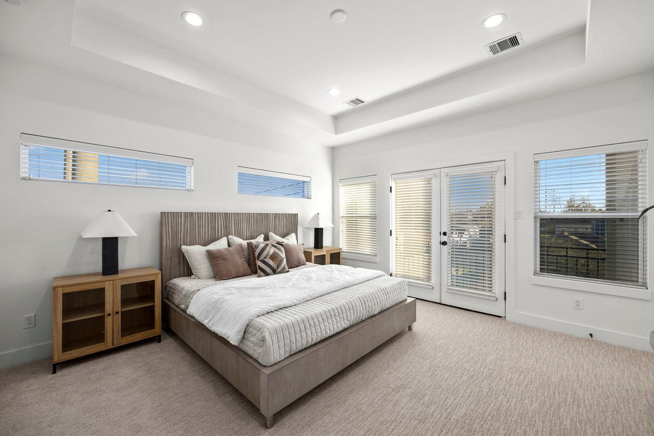 model master bedroom with a gray carpet 