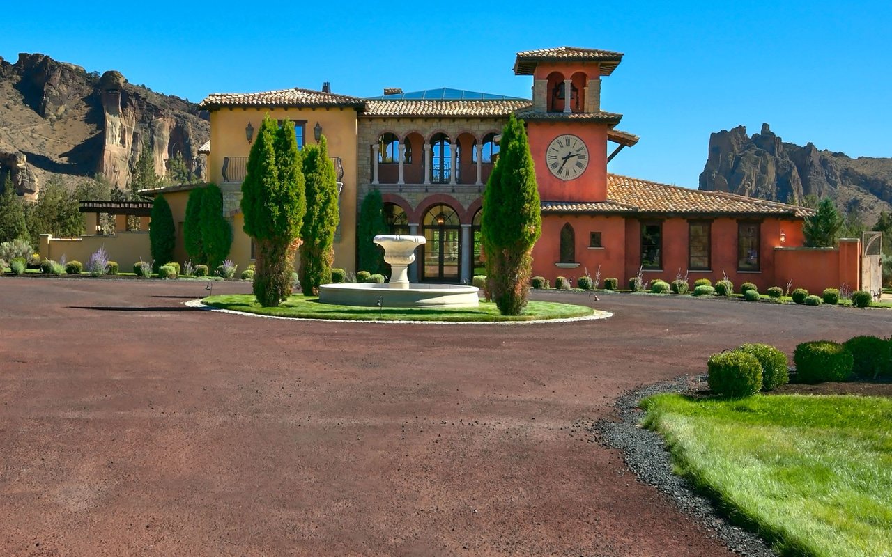 a Tuscan designed home surrounded by mountain ranges in a desert community