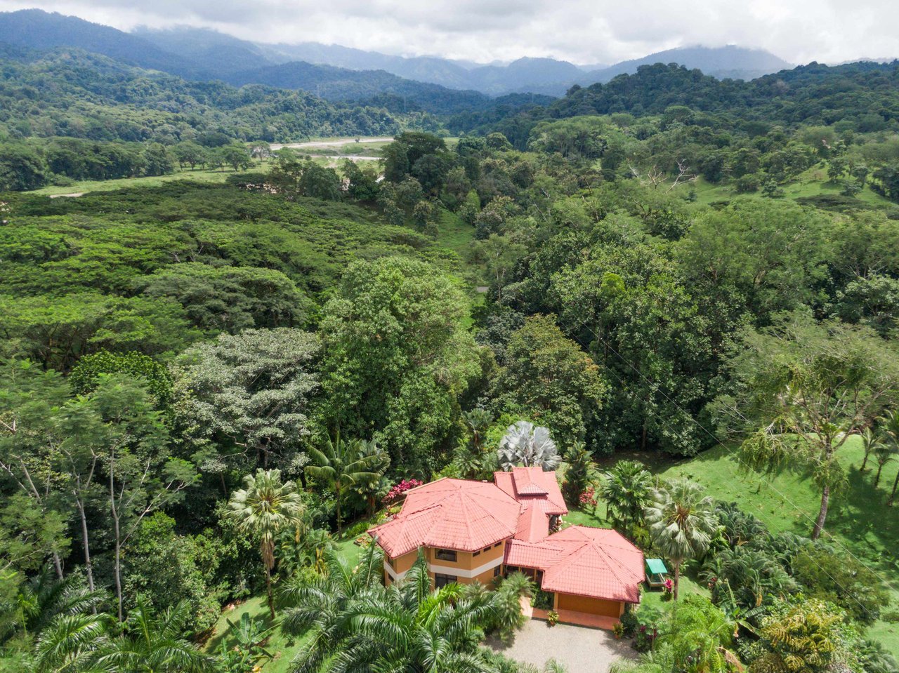 Stunning Tropical Home in Gated community with Hundreds of fruit trees  