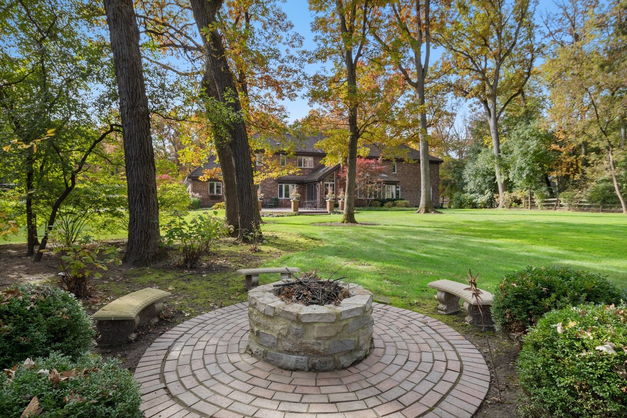 Beautifully Appointed Home in a Gated Community on Over an Acre of Professionally Landscaped Grounds with Pond Views