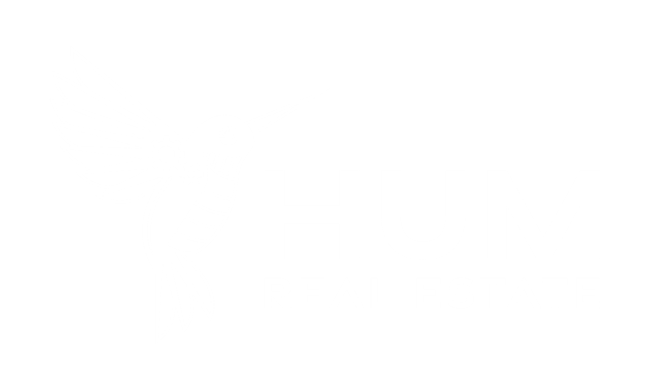 The logo features a stylized hummingbird in white against a transparent background, with the text "HUM REAL ESTATE" written beside it in a modern font.