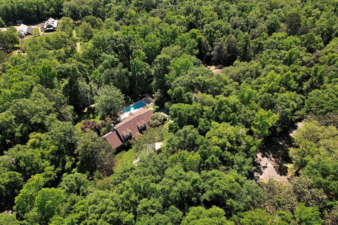 Another aerial view of a property in Bobbin Brook, highlighting the house and surrounding greenery.