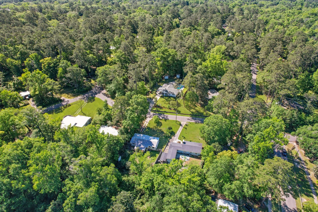 Another aerial view of the Indian Head neighborhood, showing houses and significant tree cover.