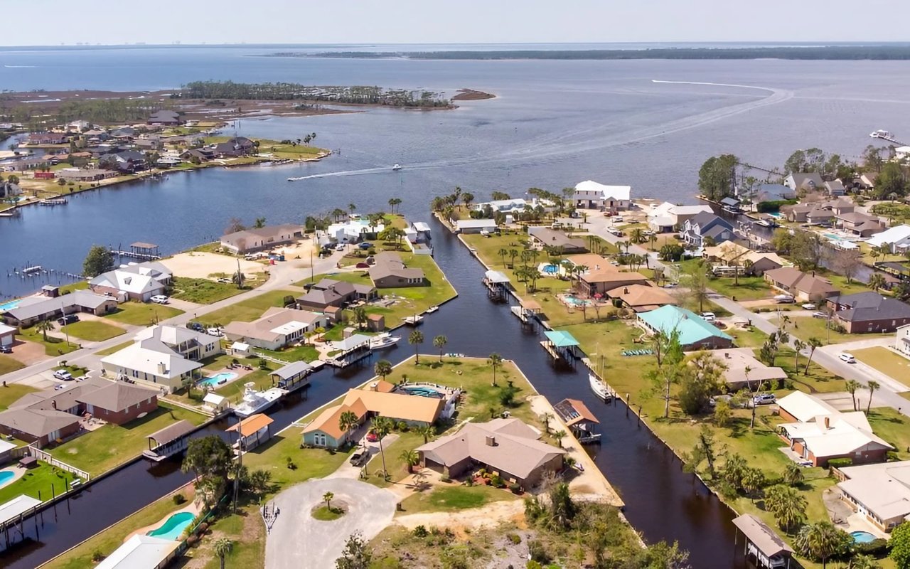 An aerial view of a coastal community with canals and waterways.