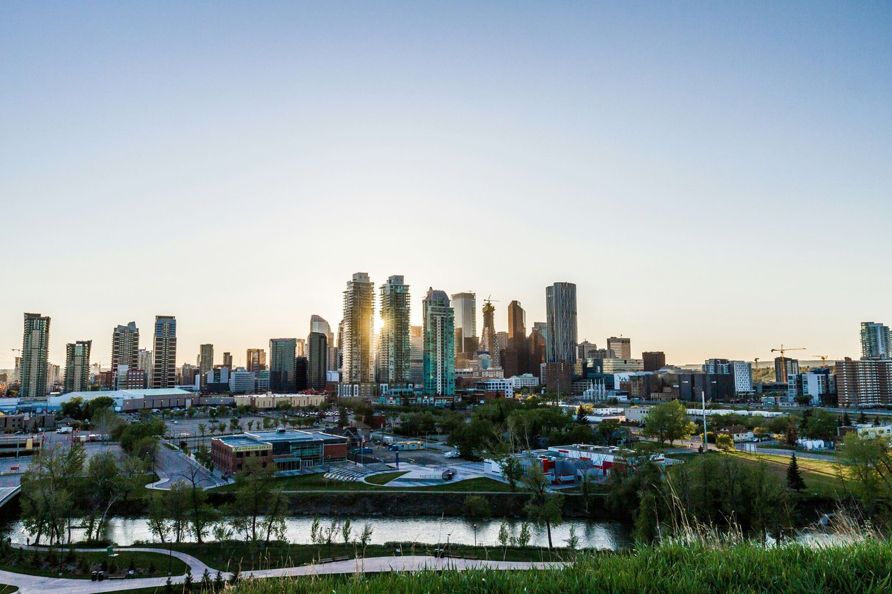 Calgary downtown skyline photo has the sun is setting from scotsman's hill 