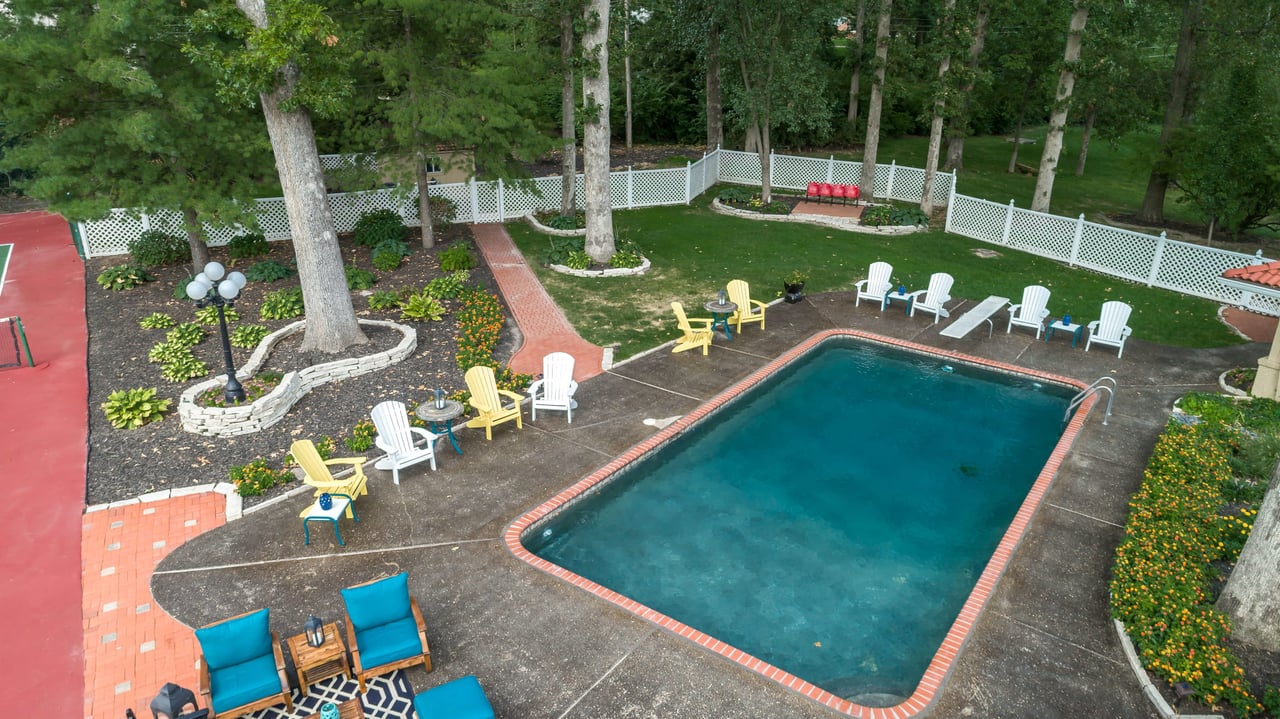 A Special Retreat on a Prized One Acre Lot With Pool and Tennis Court