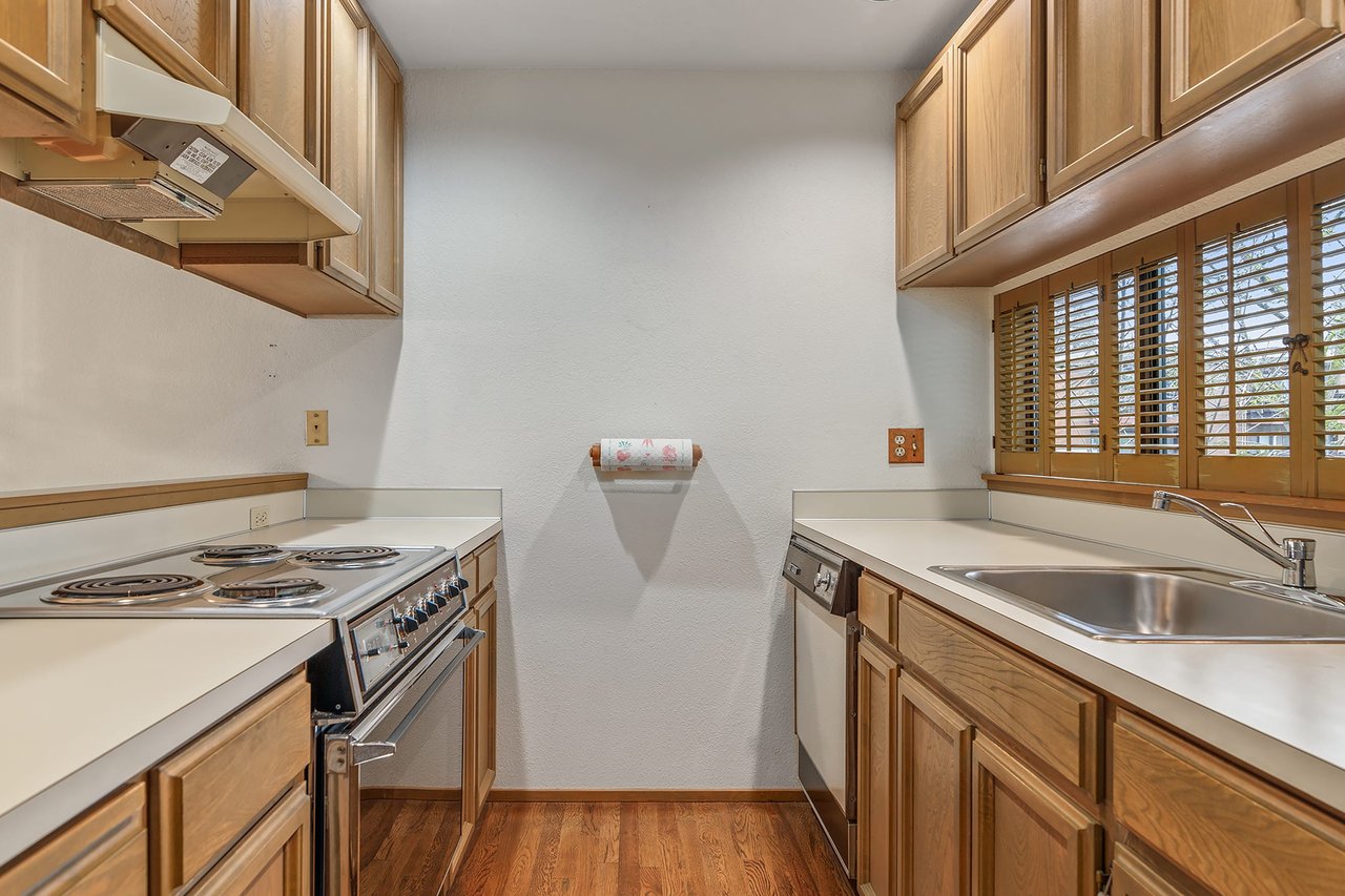 Discover the understated elegance of a simple gallery kitchen, offering practicality and style in a streamlined design perfect for modern living.