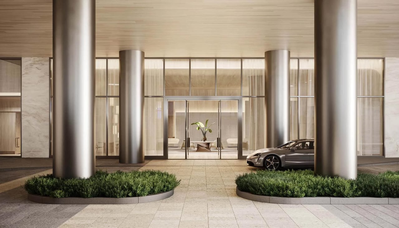 Rendering of the grand entrance with columns and a Porsche at Olara West Palm Beach