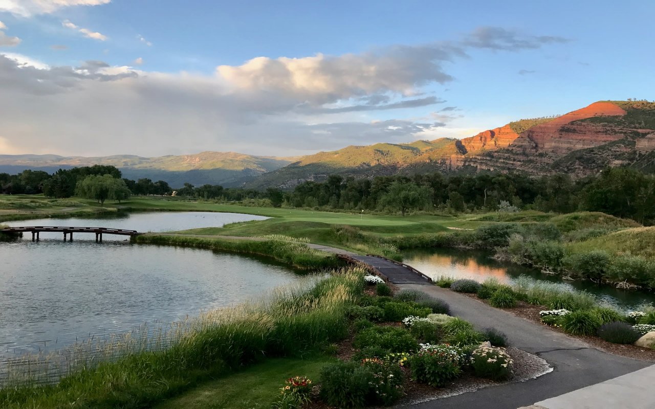 Scenic overlook of Animas River Valley, Colorado, with lush banks and mountain views.