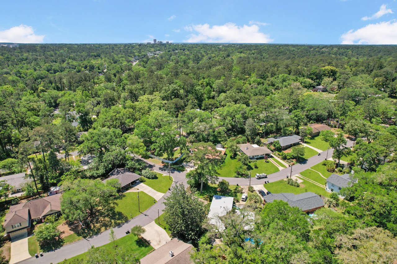 An aerial view of Waverly Hills residential neighborhood, showing houses and tree cover.