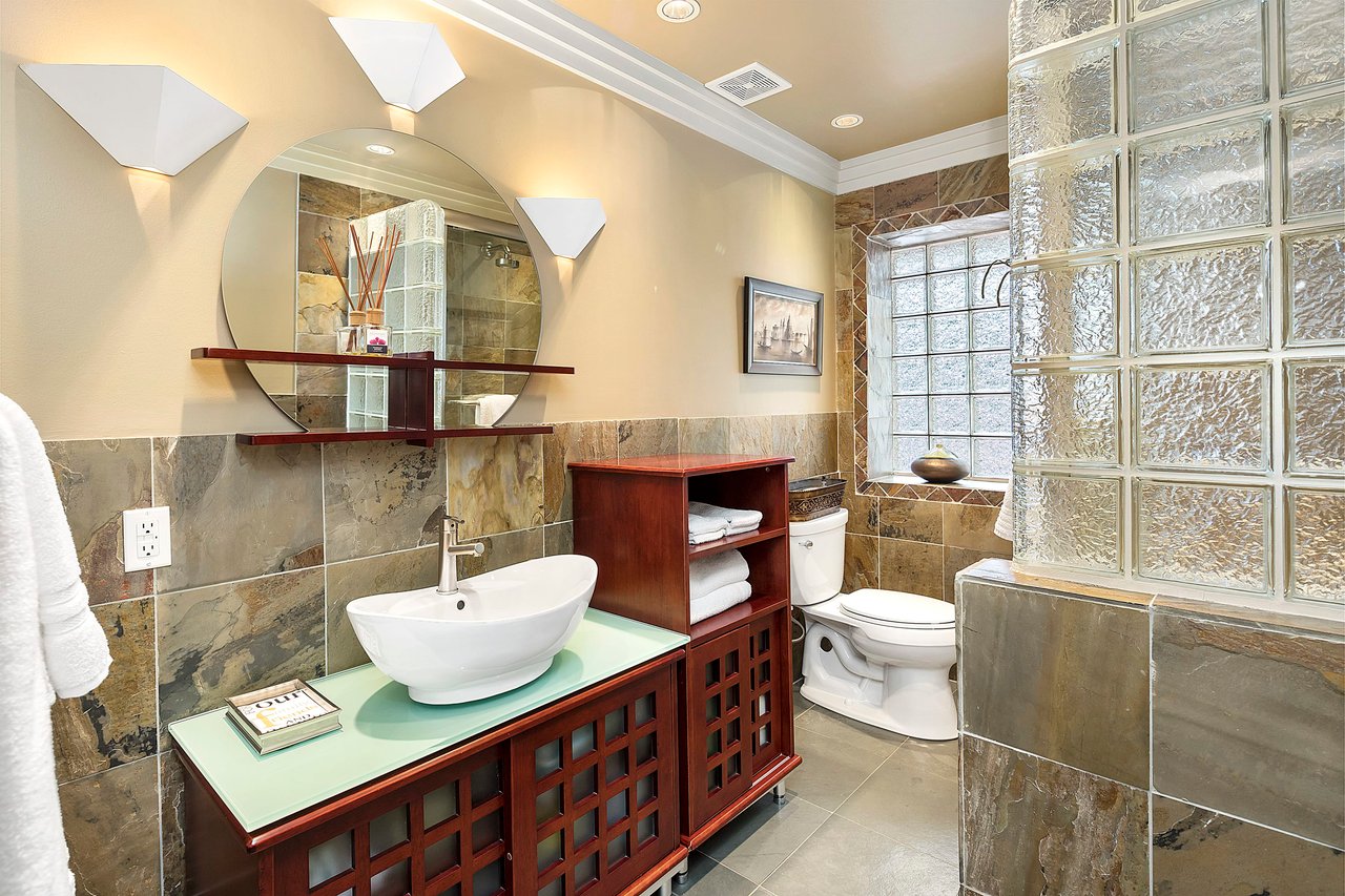 A Special Retreat on a Prized One Acre Lot With Pool and Tennis Court